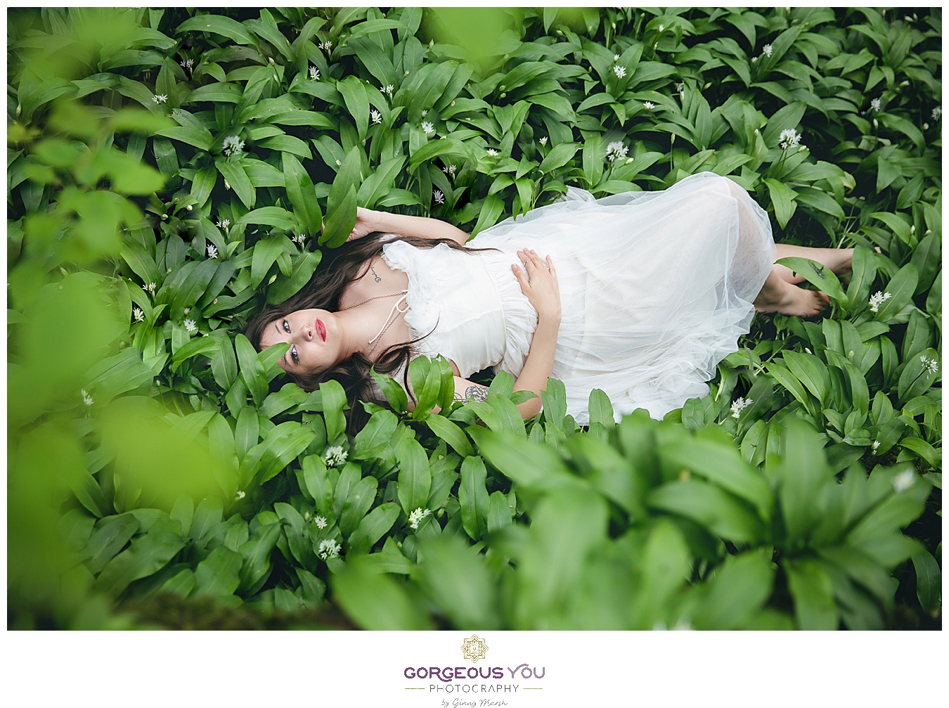 Feminine white tulle dress, lying in a bed of green wild garlic | Divine feminine goddess boudoir photoshoot | Gorgeous You Photography | North Yorkshire