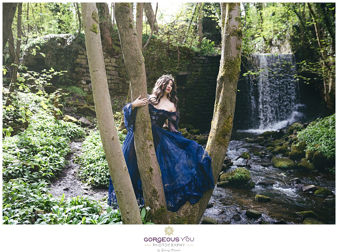 Navy tulle dress with black bodice in front of a waterfall, wearing a crown | Divine feminine goddess boudoir photoshoot | Gorgeous You Photography | North Yorkshire