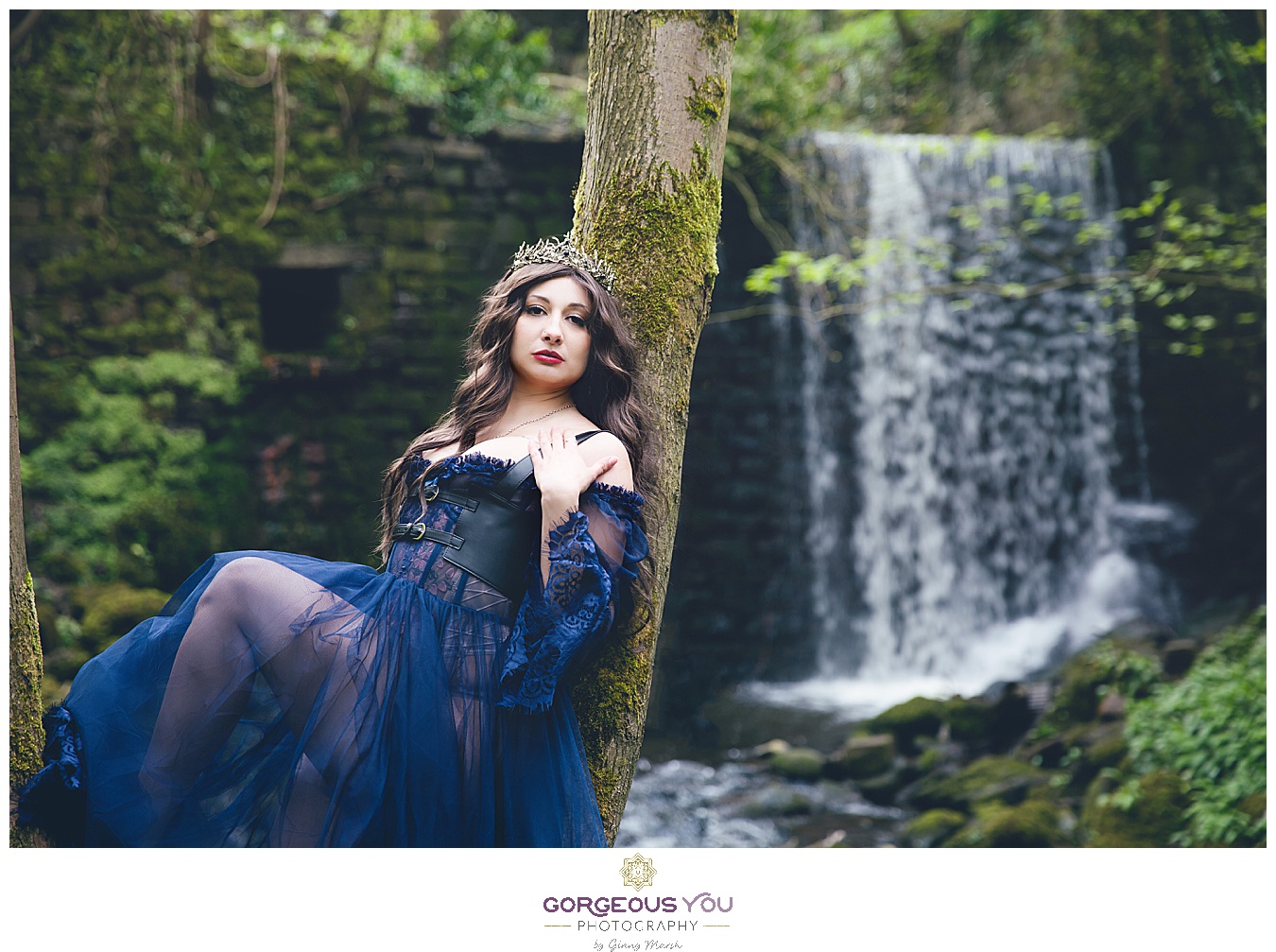 Navy tulle dress with black bodice, wearing a crown, in front of a waterfall | Divine feminine goddess boudoir photoshoot | Gorgeous You Photography | North Yorkshire