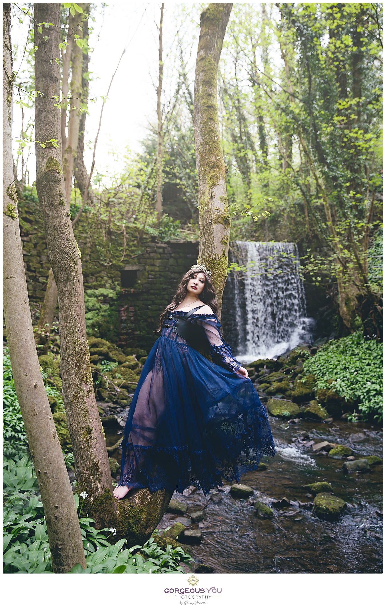 Navy tulle dress with black bodice, wearing a crown in front of a waterfall | Divine feminine goddess boudoir photoshoot | Gorgeous You Photography | North Yorkshire