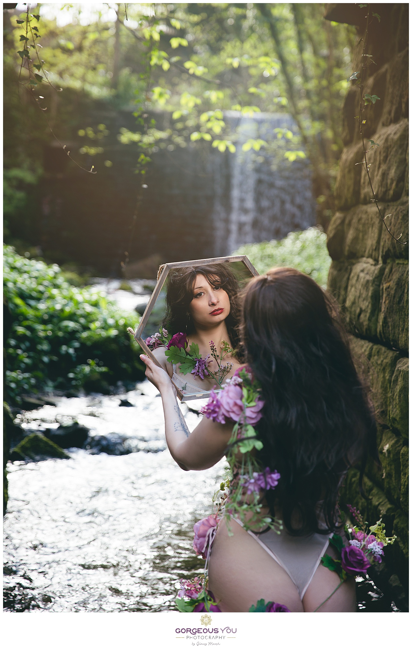 Looking in the mirror - self-reflection - in front of a waterfall | Divine feminine goddess boudoir photoshoot | Gorgeous You Photography | North Yorkshire